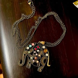 EUC adjustable necklace with colorful elephant charm.
